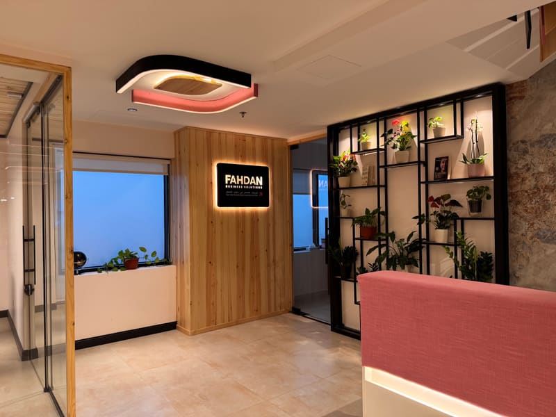 Private office with shelving and a sofa