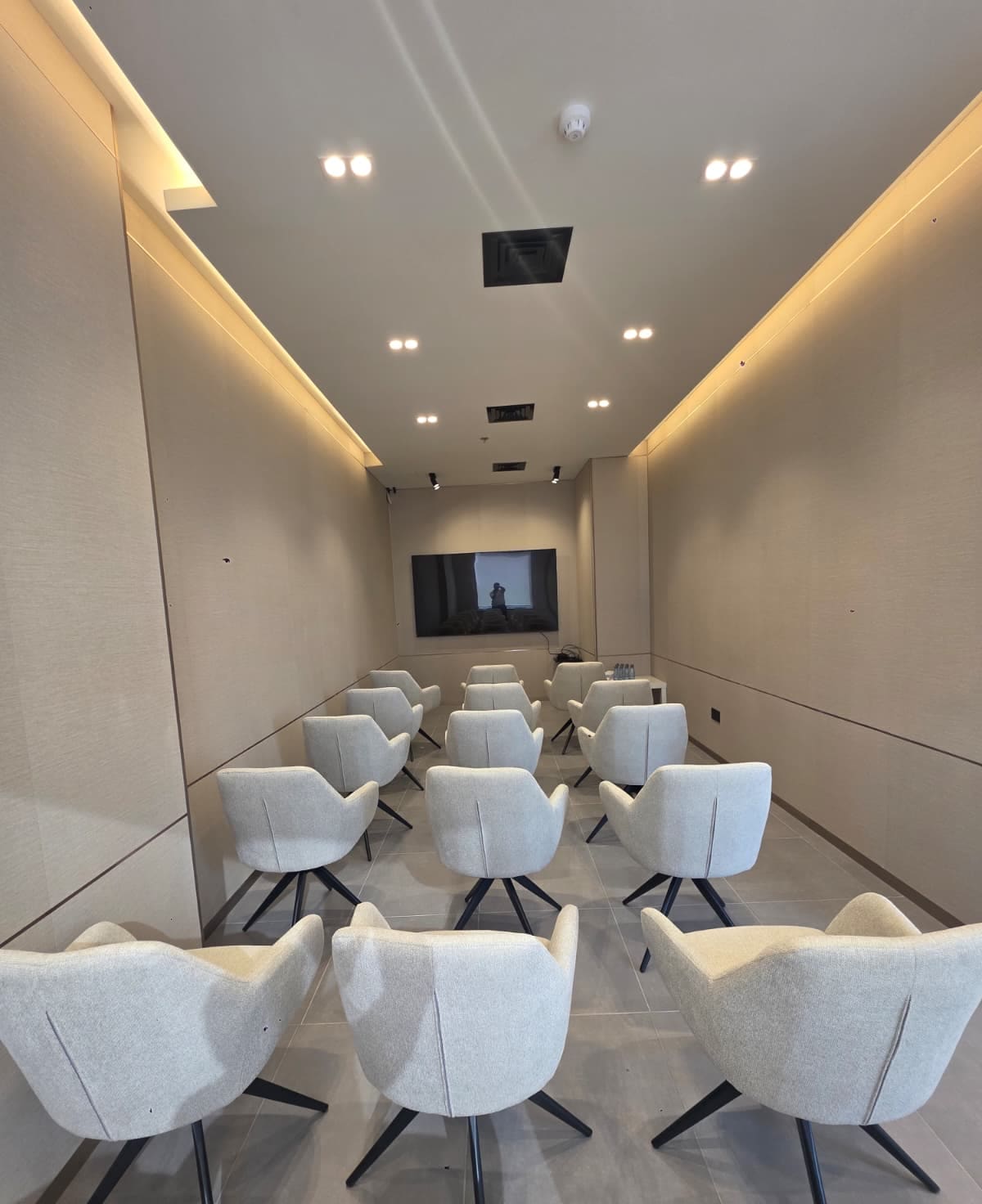The Momentum Hall, seated in rows facing the screen