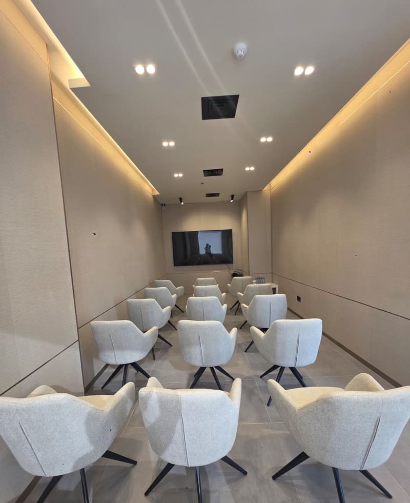 The Momentum Hall, seated in rows facing the screen